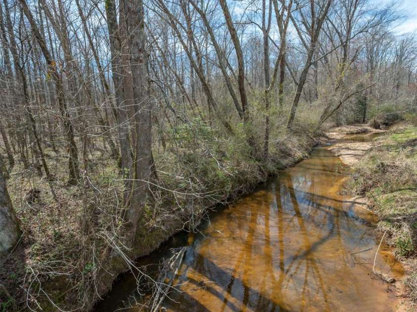 582 County Line Road, Rutherfordton, NC 28139.  MLS# CAR4235377, YatesRealty ID 5734. Henson's creek at border