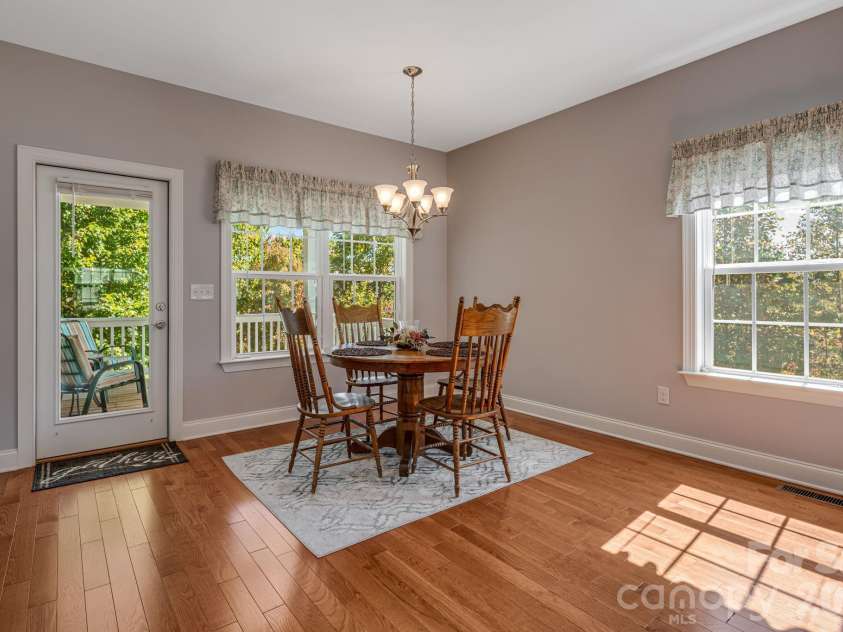76 Rose Creek Road, Leicester, NC 28748.  MLS# CAR4430015, YatesRealty ID 57341. Dining area with lots of light