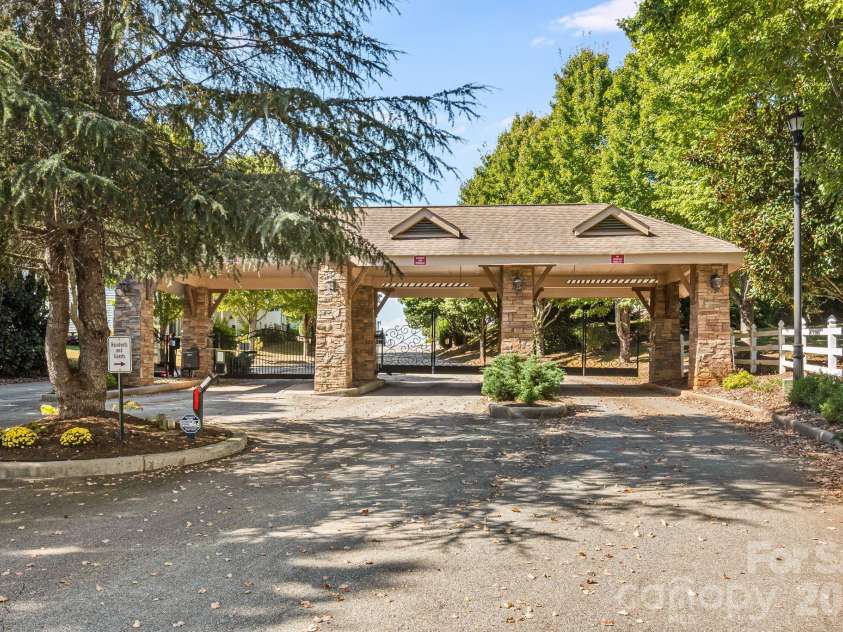 76 Rose Creek Road, Leicester, NC 28748.  MLS# CAR4430015, YatesRealty ID 57341. Gated entrance