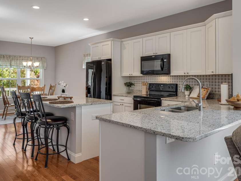 76 Rose Creek Road, Leicester, NC 28748.  MLS# CAR4430015, YatesRealty ID 57341. Kitchen Island & Breakfast Bar