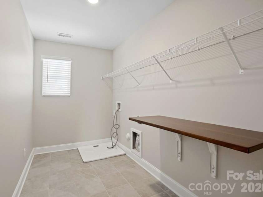 4306 Allenby Place, Monroe, NC 28110.  MLS# CAR4341972, YatesRealty ID 5737. Large Laundry Room 