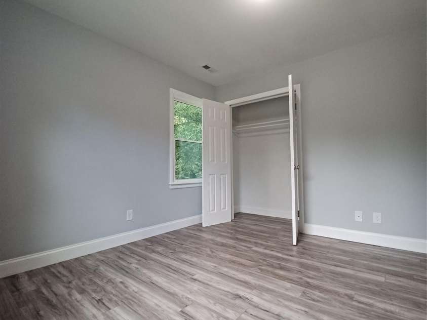 5717 Ruth Drive, Charlotte, NC 28215.  MLS# CAR4435760, YatesRealty ID 57388. Corner secondary bedroom with double door closet
