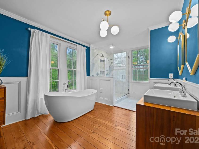 740 Woodlawn Avenue, Mount Holly, NC 28120.  MLS# CAR4244621, YatesRealty ID 5739. Beautiful wood flooring and dual vanities and modern lighting.