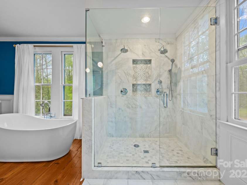 740 Woodlawn Avenue, Mount Holly, NC 28120.  MLS# CAR4244621, YatesRealty ID 5739. Free standing soaking tub and oversized shower with two shower heads and marble tile.