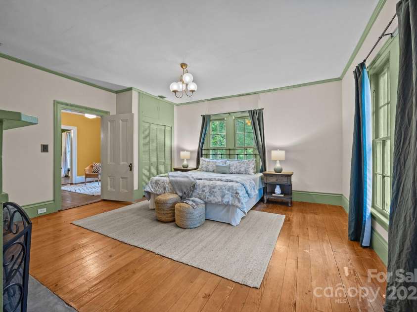 740 Woodlawn Avenue, Mount Holly, NC 28120.  MLS# CAR4244621, YatesRealty ID 5739. Primary bedroom with fireplace, reach in closet and walk in closet through the bathroom.