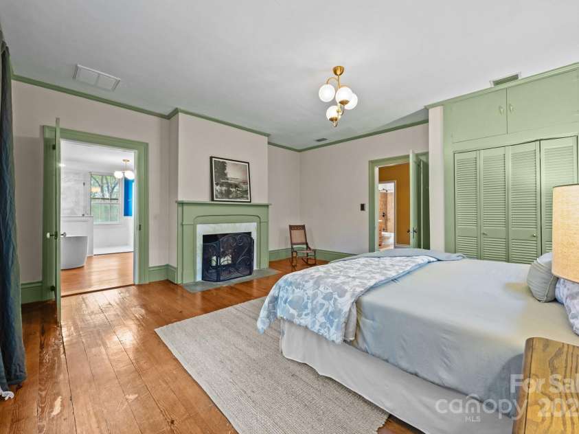 740 Woodlawn Avenue, Mount Holly, NC 28120.  MLS# CAR4244621, YatesRealty ID 5739. Primary bedroom with fireplace, reach in closet and walk in closet through the bathroom.