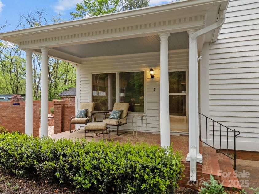 740 Woodlawn Avenue, Mount Holly, NC 28120.  MLS# CAR4244621, YatesRealty ID 5739. This is the covered porch on the left side of the home (if you're facing it).  It brings you immediately into the office/flex room.