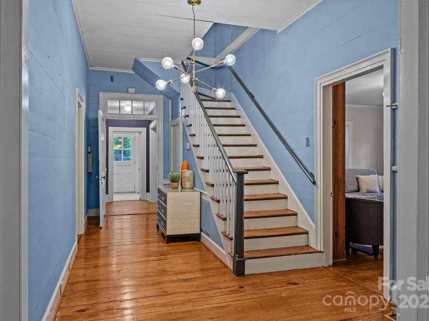 740 Woodlawn Avenue, Mount Holly, NC 28120.  MLS# CAR4244621, YatesRealty ID 5739. This middle hallway is just beyond the foyer is one of the only areas of the home that is essentially just as it was in the early 1800's (paint, lighting, etc are the exceptions).