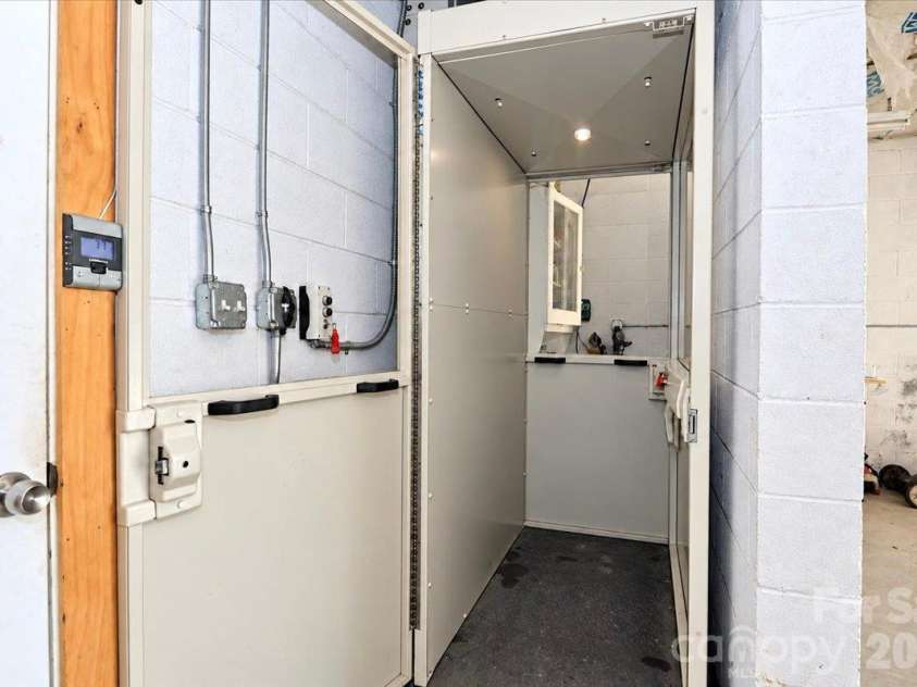 403 Front Street, Statesville, NC 28677.  MLS# CAR4430672, YatesRealty ID 57391. Elevator in Garage