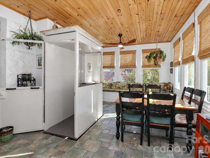 403 Front Street, Statesville, NC 28677.  MLS# CAR4430672, YatesRealty ID 57391. Sunroom with Elevator to Basement Garage