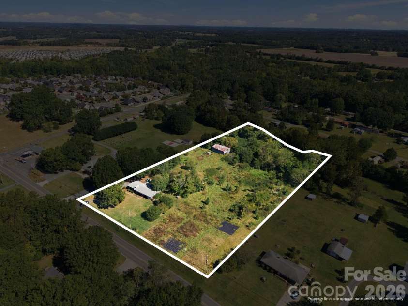 816 Central Avenue, Locust, NC 28097.  MLS# CAR4435834, YatesRealty ID 57419. Home plus the additional Lots