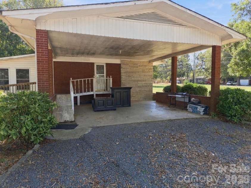 816 Central Avenue, Locust, NC 28097.  MLS# CAR4435834, YatesRealty ID 57419. Large Carport