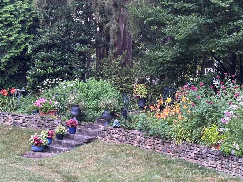 2909 Donegal Drive, Kannapolis, NC 28081.  MLS# CAR4435680, YatesRealty ID 57423. Beautiful perennial garden in full bloom