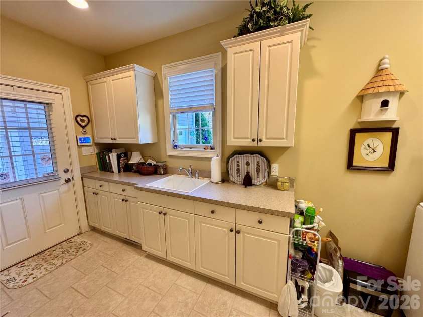 2909 Donegal Drive, Kannapolis, NC 28081.  MLS# CAR4435680, YatesRealty ID 57423. Laundry room-access to the covered breezeway from the garage