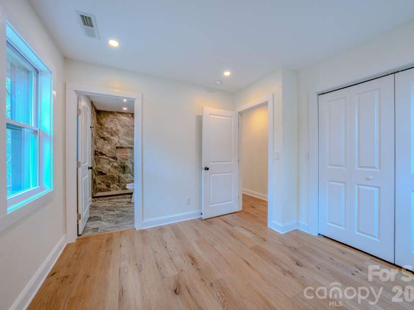 115 Silver Dapple Lane, Hendersonville, NC 28792.  MLS# CAR4434968, YatesRealty ID 57472. Bedroom with ensuite bath