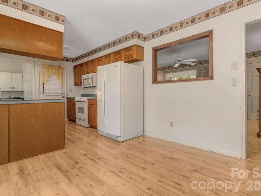 1 Dewberry Lane, Hendersonville, NC 28792.  MLS# CAR4435645, YatesRealty ID 57487. Dining area looking into kitchen