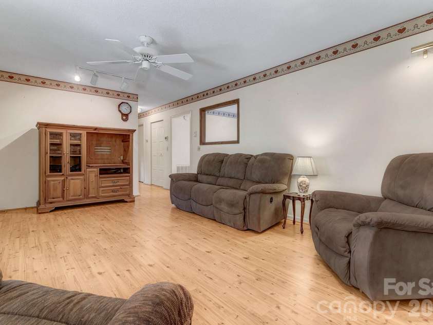 1 Dewberry Lane, Hendersonville, NC 28792.  MLS# CAR4435645, YatesRealty ID 57487. Great room looking into hallway & kitchen access