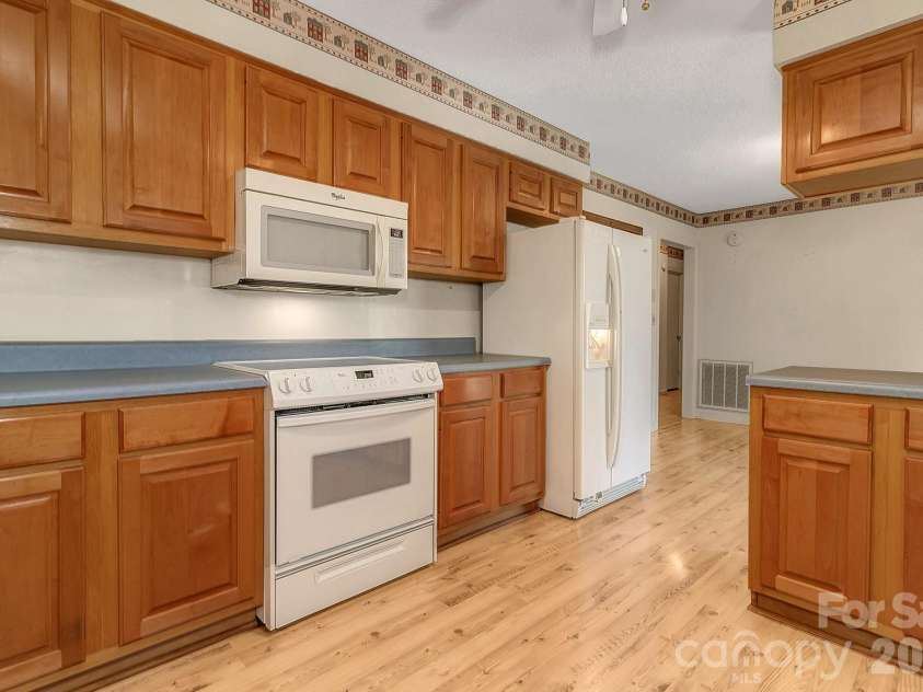 1 Dewberry Lane, Hendersonville, NC 28792.  MLS# CAR4435645, YatesRealty ID 57487. Kitchen view from laundry room