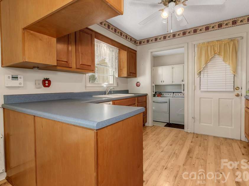 1 Dewberry Lane, Hendersonville, NC 28792.  MLS# CAR4435645, YatesRealty ID 57487. Kitchen w/window over sink & ceiling fan