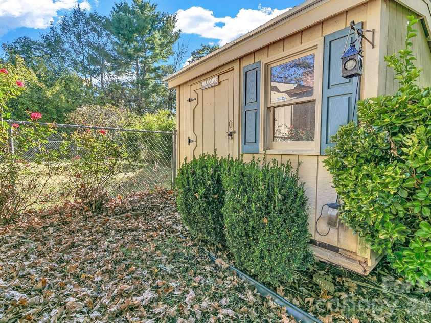 1 Dewberry Lane, Hendersonville, NC 28792.  MLS# CAR4435645, YatesRealty ID 57487. Shed in back yard w/storage capacity