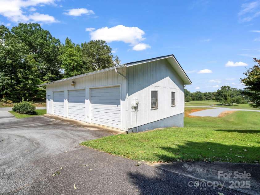 256 School Road, Mill Spring, NC 28756.  MLS# CAR4299323, YatesRealty ID 5755. 3-Car garage with electric. 