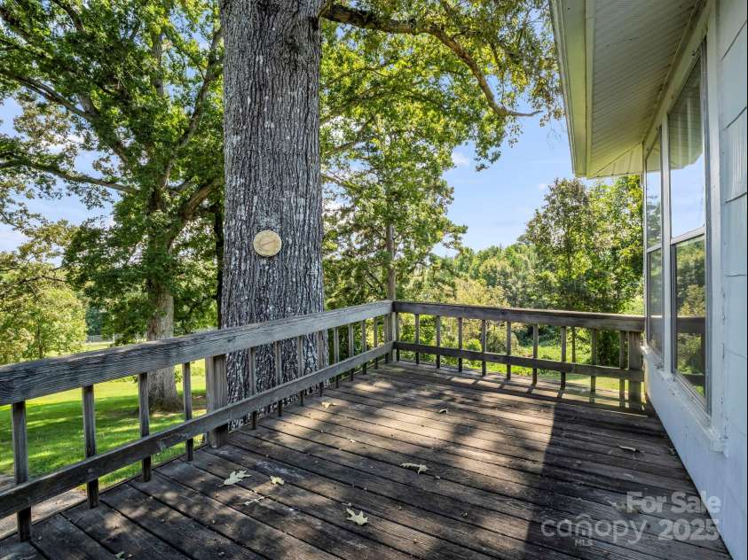 256 School Road, Mill Spring, NC 28756.  MLS# CAR4299323, YatesRealty ID 5755. Back deck, off Kitchen.  Railing probably not up to code