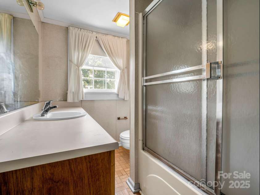 256 School Road, Mill Spring, NC 28756.  MLS# CAR4299323, YatesRealty ID 5755. Bathroom on the Main Level