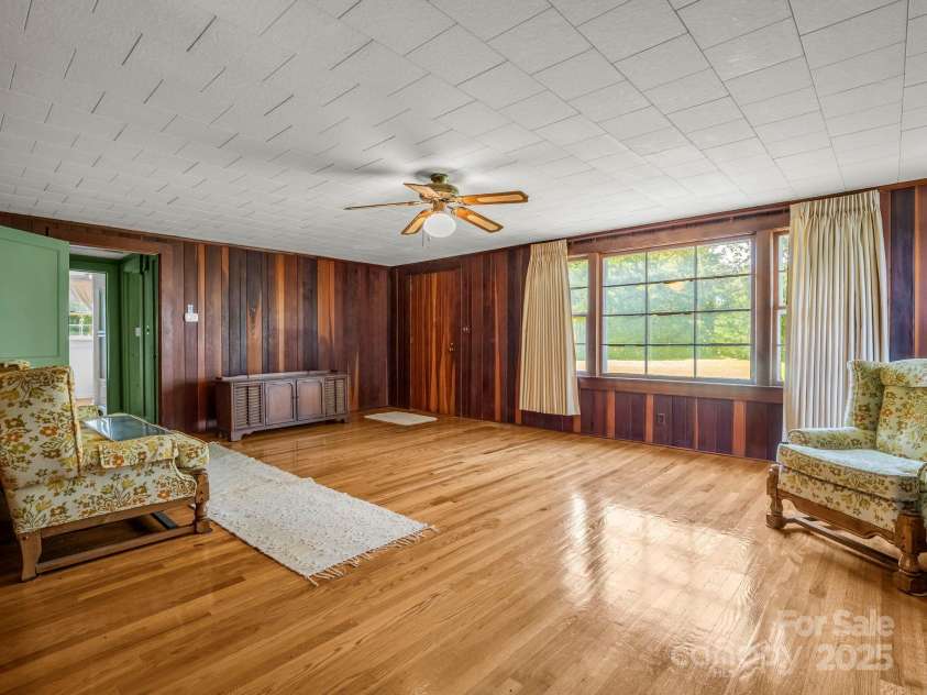 256 School Road, Mill Spring, NC 28756.  MLS# CAR4299323, YatesRealty ID 5755. Beautiful solid wood paneling on walls & hardwood floors