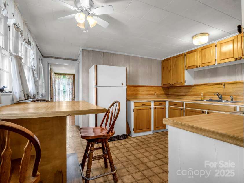256 School Road, Mill Spring, NC 28756.  MLS# CAR4299323, YatesRealty ID 5755. Bright and spacious Kitchen.
