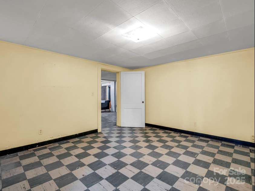256 School Road, Mill Spring, NC 28756.  MLS# CAR4299323, YatesRealty ID 5755. Flex room in the basement