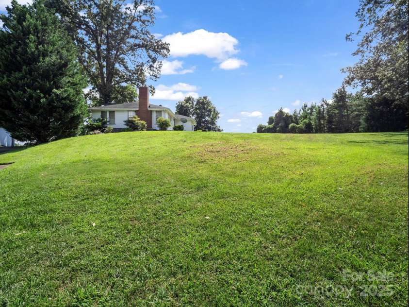 256 School Road, Mill Spring, NC 28756.  MLS# CAR4299323, YatesRealty ID 5755. Great yard for garden or recreation