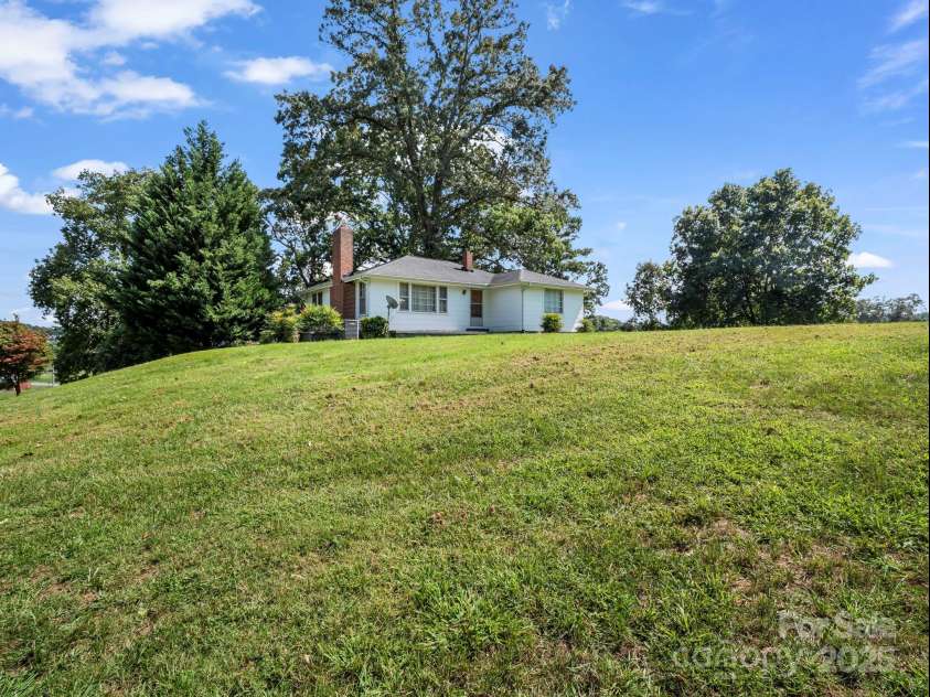 256 School Road, Mill Spring, NC 28756.  MLS# CAR4299323, YatesRealty ID 5755. Nice open yard