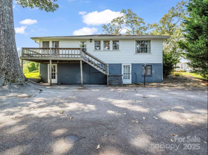 256 School Road, Mill Spring, NC 28756.  MLS# CAR4299323, YatesRealty ID 5755. Parking area for rear/main entry