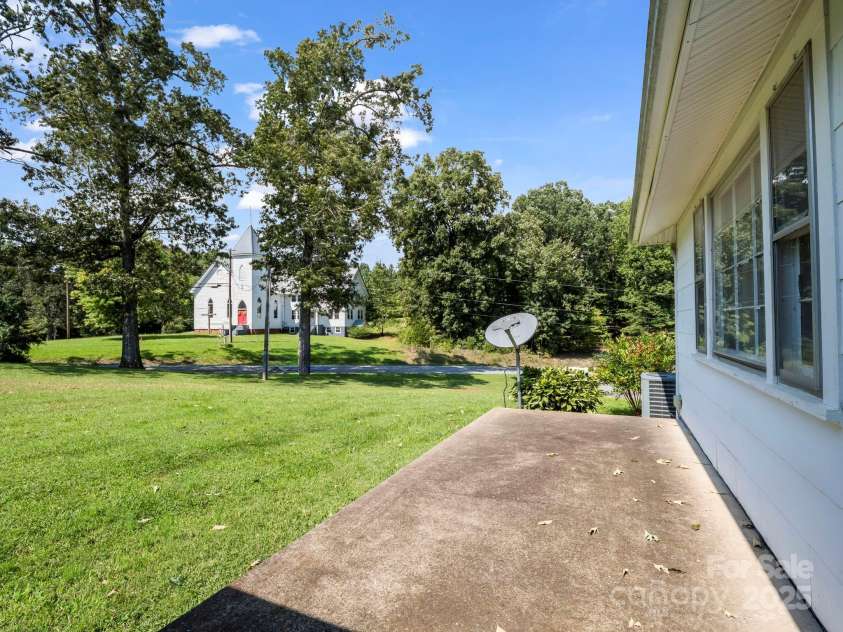 256 School Road, Mill Spring, NC 28756.  MLS# CAR4299323, YatesRealty ID 5755. Patio off living room