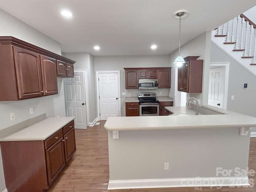 201 Colonel Holcombe Place, Candler, NC 28715.  MLS# CAR4436091, YatesRealty ID 57568. Breakfast bar into Kitchen