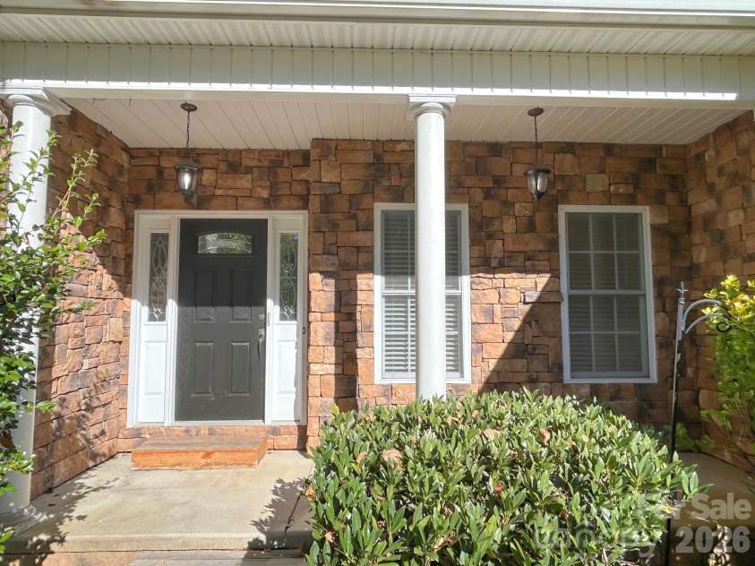 201 Colonel Holcombe Place, Candler, NC 28715.  MLS# CAR4436091, YatesRealty ID 57568. Covered front porch