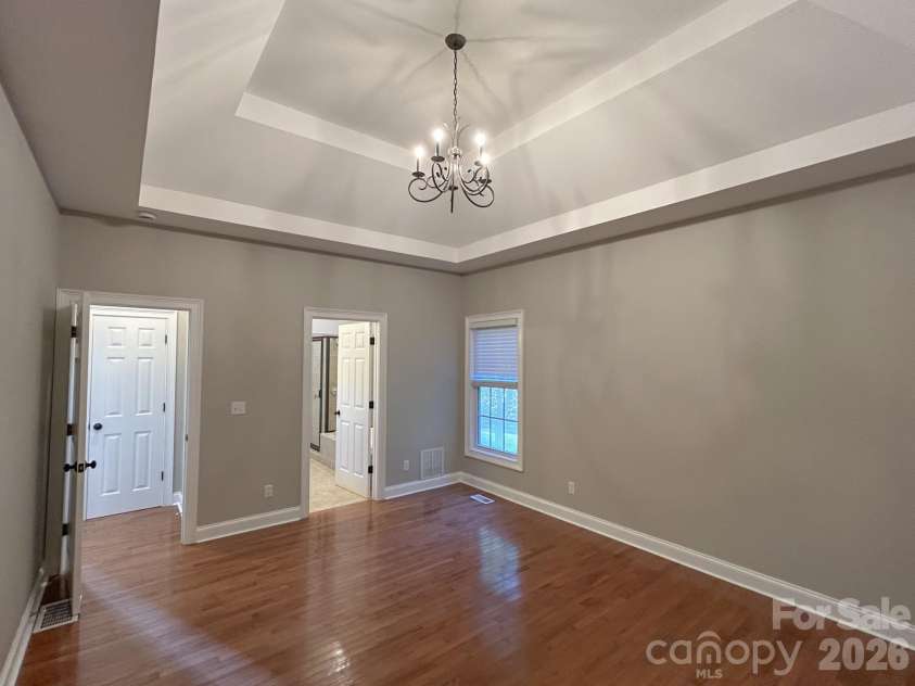 201 Colonel Holcombe Place, Candler, NC 28715.  MLS# CAR4436091, YatesRealty ID 57568. Primary BR with tray ceiling