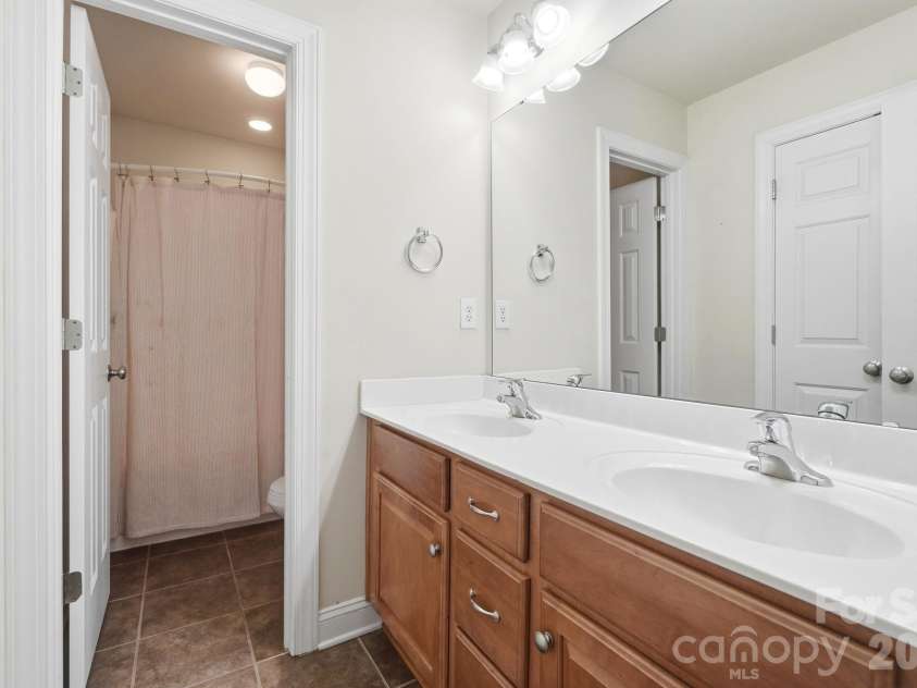 9915 Nicole Lane, Charlotte, NC 28269.  MLS# CAR4396423, YatesRealty ID 5758. Guest Bathroom