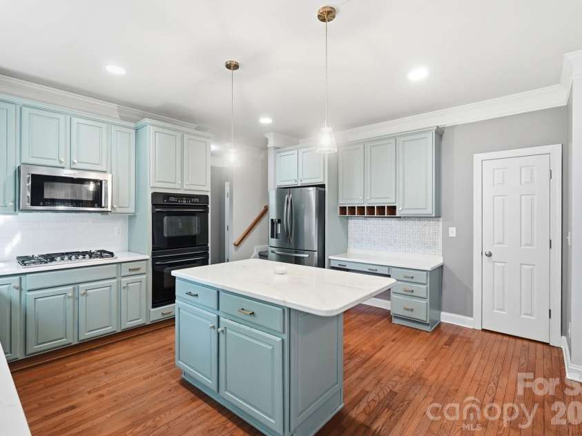 9915 Nicole Lane, Charlotte, NC 28269.  MLS# CAR4396423, YatesRealty ID 5758. Kitchen with Secondary Staircase