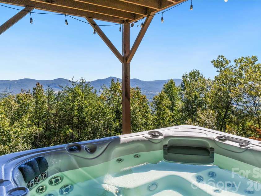 656 Arbra Mountain Way, Bostic, NC 28018.  MLS# CAR4432253, YatesRealty ID 57598. Lower Level - Covered Patio with Oversized Hot Tub