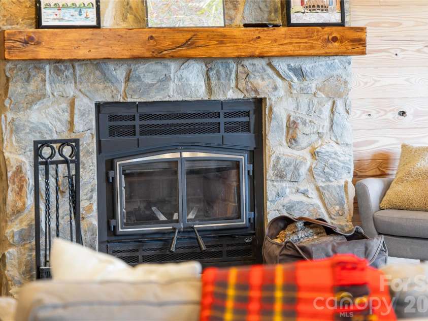 656 Arbra Mountain Way, Bostic, NC 28018.  MLS# CAR4432253, YatesRealty ID 57598. Lower Level - wood fireplace, natural stone