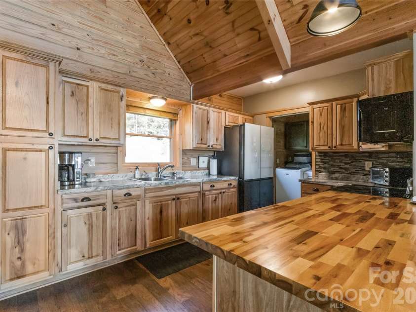 656 Arbra Mountain Way, Bostic, NC 28018.  MLS# CAR4432253, YatesRealty ID 57598. Open Kitchen and Mud Room/Laundry beyond