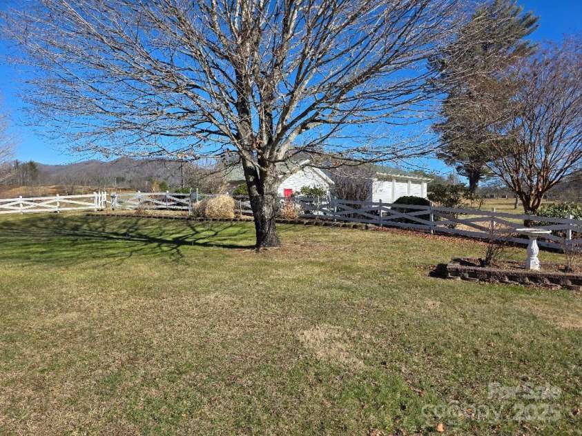 1375 US Highway 19E Highway, Burnsville, NC 28714.  MLS# CAR4329254, YatesRealty ID 576. Back yard looking east