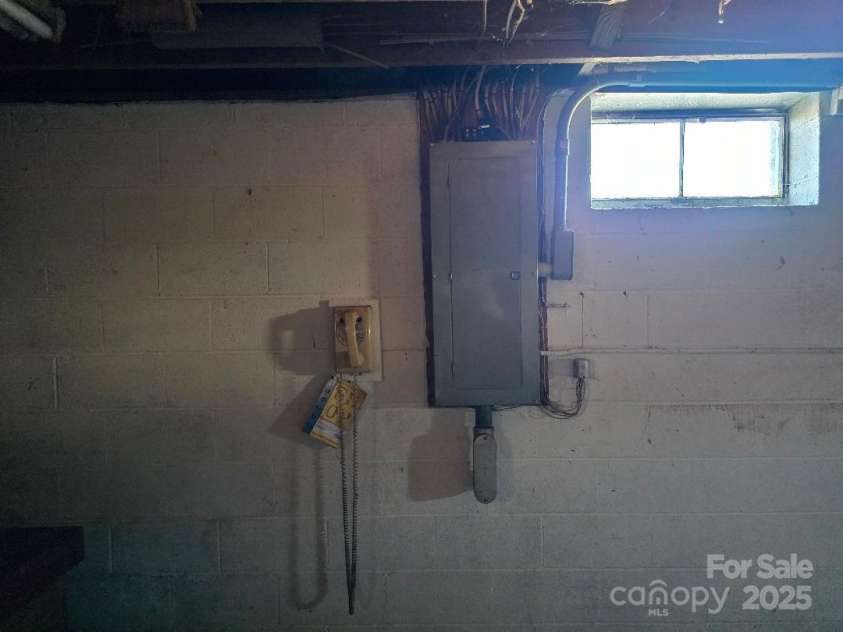 1375 US Highway 19E Highway, Burnsville, NC 28714.  MLS# CAR4329254, YatesRealty ID 576. Breaker panel in basement