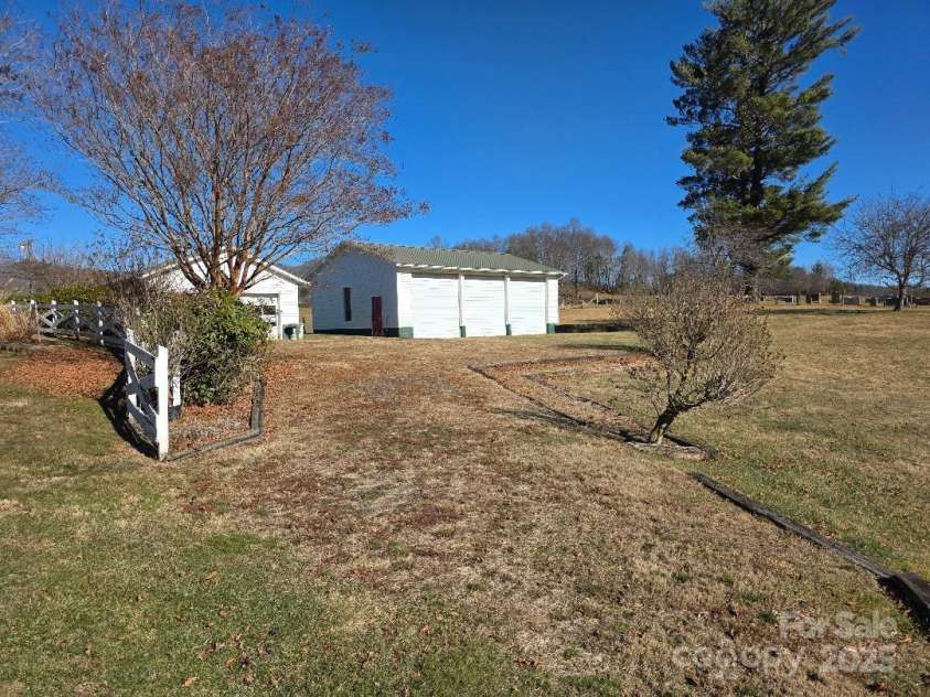1375 US Highway 19E Highway, Burnsville, NC 28714.  MLS# CAR4329254, YatesRealty ID 576. Driveway to the detached garages