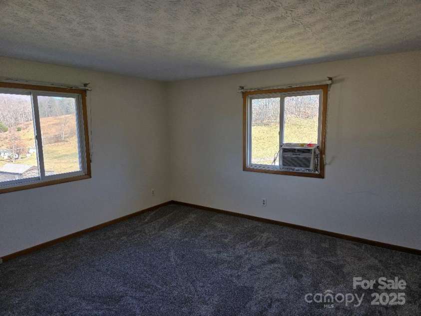 1375 US Highway 19E Highway, Burnsville, NC 28714.  MLS# CAR4329254, YatesRealty ID 576. Primary bedroom