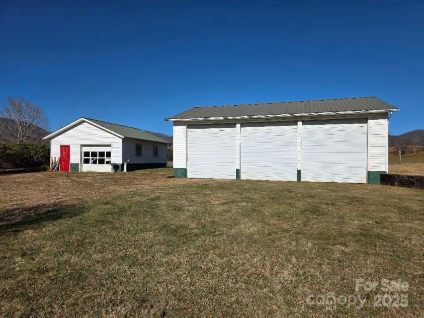 1375 US Highway 19E Highway, Burnsville, NC 28714.  MLS# CAR4329254, YatesRealty ID 576. Three car RV garage and one car garage and shop