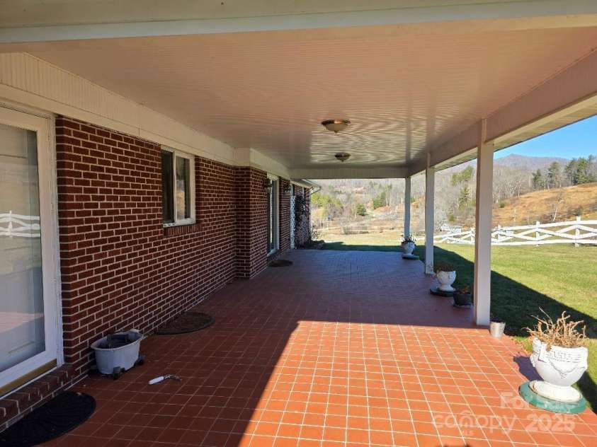 1375 US Highway 19E Highway, Burnsville, NC 28714.  MLS# CAR4329254, YatesRealty ID 576. Tiled and covered patio 