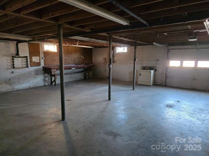 1375 US Highway 19E Highway, Burnsville, NC 28714.  MLS# CAR4329254, YatesRealty ID 576. Workshop area in the basement
