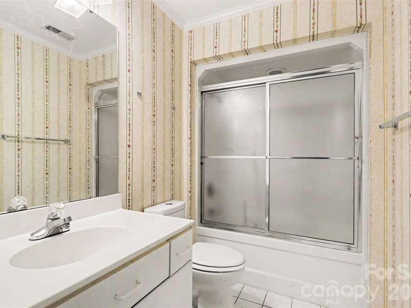 8407 Coulwood Oak Lane, Charlotte, NC 28214.  MLS# CAR4435190, YatesRealty ID 57608. Hall Bathroom